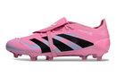 Chuteira Adidas Predator Elite FG Tongue Rosa lateral destacando design moderno em rosa e preto.