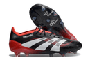 Chuteira Adidas Predator Elite FG - Vermelha e Preta com design icônico e sola FG para aderência superior.