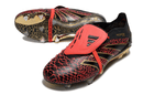 Chuteira Adidas Predator Elite Fold-Over Tongue FG - Preta, Dourada e Vermelha com design arrojado.