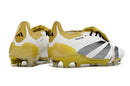 Chuteira Adidas Predator Elite Tongue FG - Branca, Dourada e Preta com design sofisticado e tecnologia para desempenho.