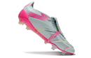 Chuteira Adidas Predator Elite Tongue FG - Branca e Rosa em ângulo, destacando seu design moderno e cores vibrantes.