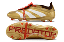 Chuteira Adidas Predator Elite Tongue FG - Dourada e Branca com detalhes sofisticados e design premium.