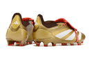 Chuteira Adidas Predator Elite Tongue FG - Dourada e Branca com design premium e sofisticado.