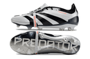 Chuteira Adidas Predator Elite Tongue FG - Preta e Branca com design inovador e tecnologia de controle de bola.