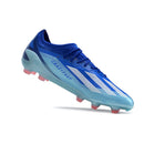 Chuteira Adidas X Crazyfast FG Elite .1 Azul em destaque com design aerodinâmico e cores vibrantes.