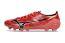 Chuteira Mizuno Alpha II FG "Ruby Red" com design vibrante e tecnologia avançada para performance em campo.