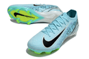 Chuteira Nike Air Zoom Mercurial Vapor 16 Elite FG - Azul e Verde vista lateral com detalhes em preto e verde.