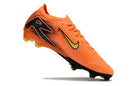 Chuteira Nike Air Zoom Mercurial Vapor 16 Elite FG - Laranja vista lateral com design aerodinâmico.