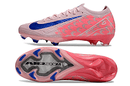 Chuteira Nike Air Zoom Mercurial Vapor 16 Elite FG Laranja e Azul em destaque, mostrando design e sola.