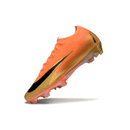 Chuteira Nike Air Zoom Mercurial Vapor 16 Laranja e Preta com design aerodinâmico e leveza.