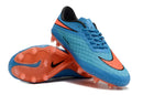 Chuteira Nike Hypervenom Elite FG Azul e Laranja com design vibrante e tecnologia de alta performance.