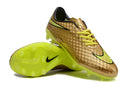 Chuteira Nike Hypervenom Elite FG - Dourada com design premium e estrutura FG em dourado e verde.