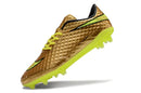 Chuteira Nike Hypervenom Elite FG - Dourada em dourado com detalhes em verde e estrutura FG para desempenho no futebol.