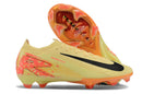 Chuteira Nike Mercurial Air Zoom Vapor 16 Elite FG Amarelo e Laranja em destaque, mostrando design e sola.