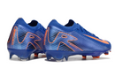 Chuteira Nike Mercurial Air Zoom Vapor 16 Elite FG Azul e Laranja, design aerodinâmico para triunfar no campo.