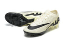 Chuteira Nike Mercurial Vapor 15 Air Zoom FG Bege e Preta vista lateral e inferior, design leve e tecnologia de alto desempenho.