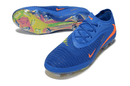 Chuteira Nike Phantom 6 Elite FG - Azul e Laranja, destacando design em azul com detalhes em laranja e sola FG.