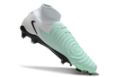 Chuteira Nike Phantom Luna Elite NU FG Branca, Verde e Preto com design inovador e tecnologia de ponta.