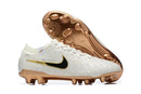Chuteira Nike Tiempo Legend 10 FG - Pack United com design premium em branco e detalhes dourados.