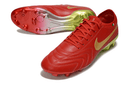 Chuteira Nike Tiempo Legend X Elite FG Vermelha com design vibrante em vermelho e detalhes em dourado.