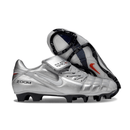 Chuteira Nike Total 90 FG Prata e Branco em design sofisticado para futebolistas.