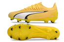 Chuteira Puma Ultra Ultimate FG Amarela vista lateral e inferior, ideal para desempenho em campos naturais.