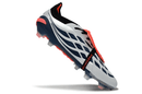 Chuteira Adidas Predator Elite FG 26 - "Finishers Steel" em destaque, com design inovador e cores vibrantes.