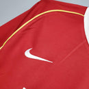 Camisa retrô Manchester United Home 06/07 com detalhes em vermelho e logo Nike.