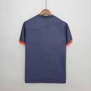 Camiseta PSG Home 13/14 Retro Azul Olympic vista traseira com detalhes em laranja.