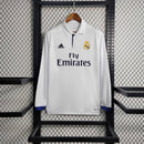 Camisola Real Madrid Home 16/17 manga longa em exibição na OLYMPIC STORE, com detalhes em azul e logo da Adidas.