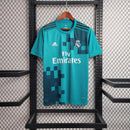 Camisola Real Madrid Third 17/18 Azul, estilo retro, com logo e patrocinador Fly Emirates, em exibição na OLYMPIC STORE.